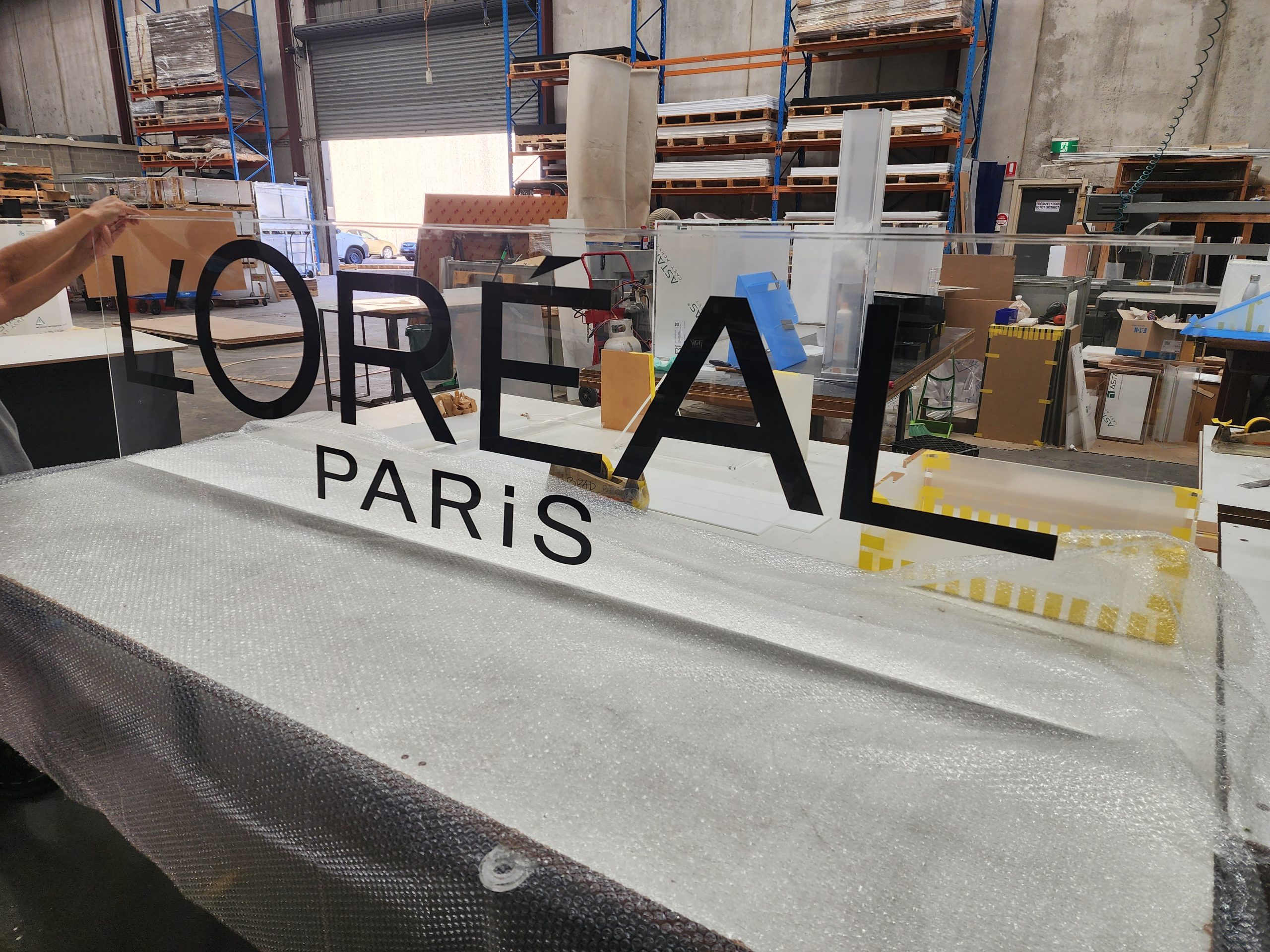 Black-Acrylic-sign-on-clear-acrylic-backing